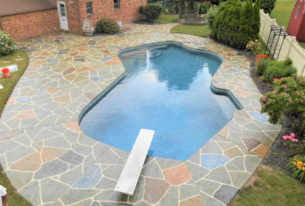 colored stamped concrete pool deck